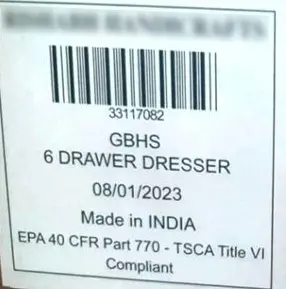 White label on the back of the recalled dresser