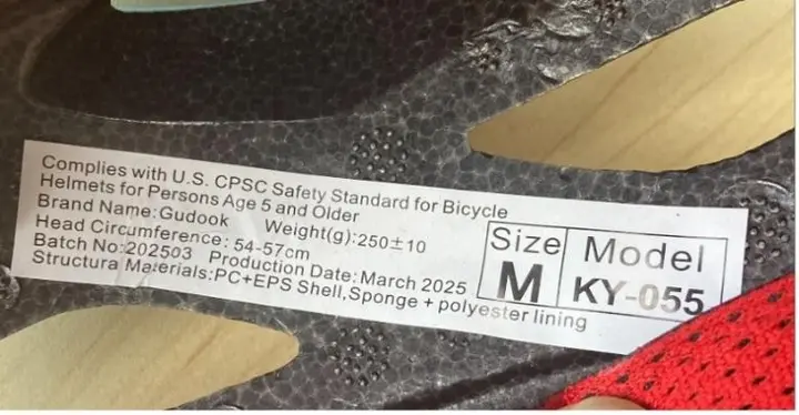 "Model KY- 055", "Batch No: 202503" and "Production Date: March 2025" are printed on a label on the inside of the recalled Gudook bicycle helmet