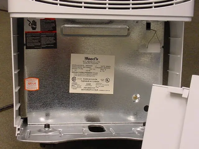 Label behind the removable water bucket of recalled dehumidifier
