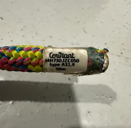Tag on end of climbing rope (lollipop color) showing brand, part number, type and length