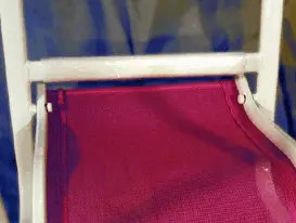 Plastic bolt covers on recalled Home Trends Kiddy Sling Chair