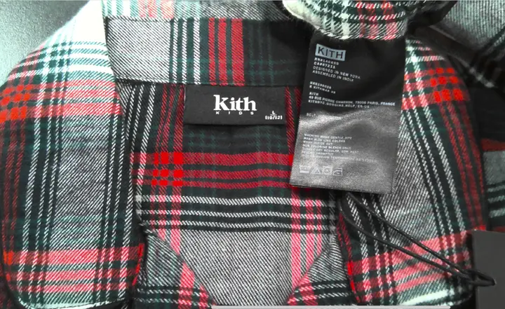 "Kith Kids" and the size are printed on the recalled pajama's neck label