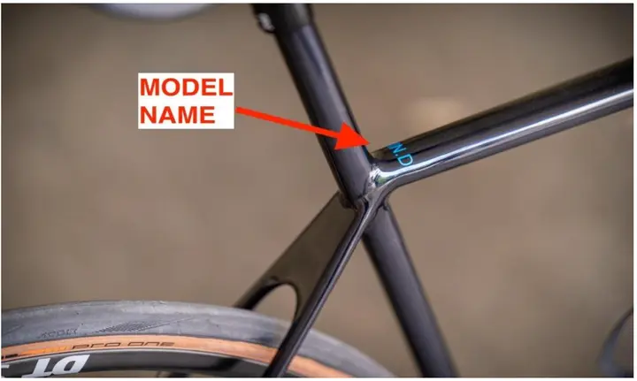The model name on the top of the top tube, near the seat tube