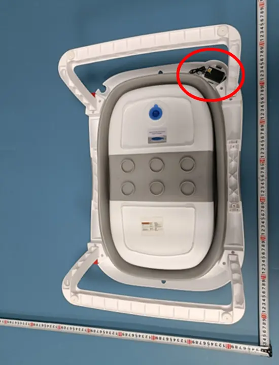 Bottom view of the Recalled Napei Collapsible Infant Bath Tub showing location of battery compartment