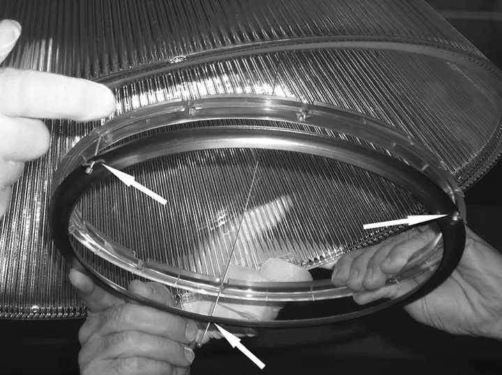 Underside of the ring holding the glass diffuser. If this piece is plastic only, it is part of the recall.