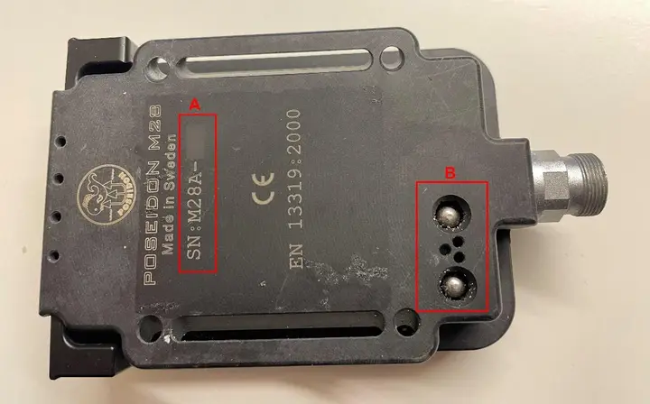Serial Number beginning with "M28A-" and two wet-switches located on the back of recalled Poseidon A28 Dive Computer
