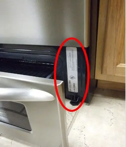 Serial plate is located by opening the range drawer at the bottom of the unit