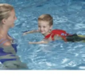 Child using recalled "Sandy Claws" Swim Trainer