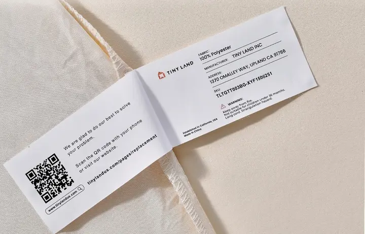 The Tiny Land logo and batch number TLTGTT003BG-XYF1506251 are printed on a label stitched on inside of the recalled play tent