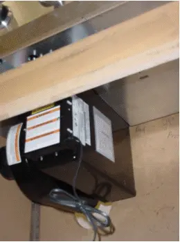 Location of label on vent fan housing, in the cabinet under recalled cooktop