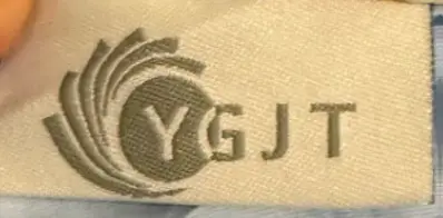 "YGJT" is printed on an attached label on the outside of the baby lounger's cover