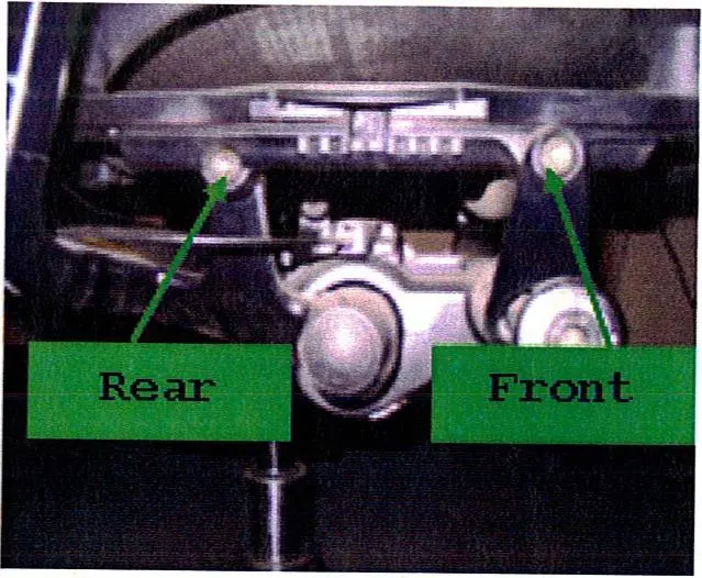 Bolts that attach the seat bottom to the chair frame
