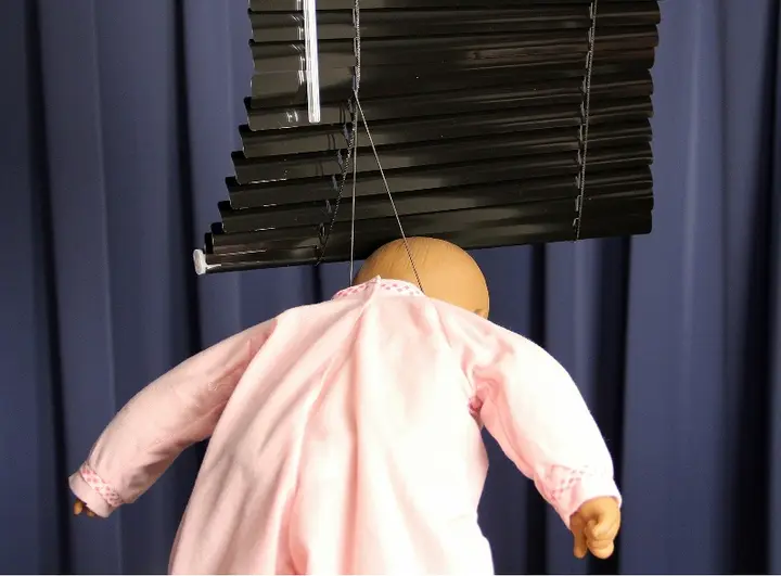 Recalled horizontal window blind showing cord strangulation hazard